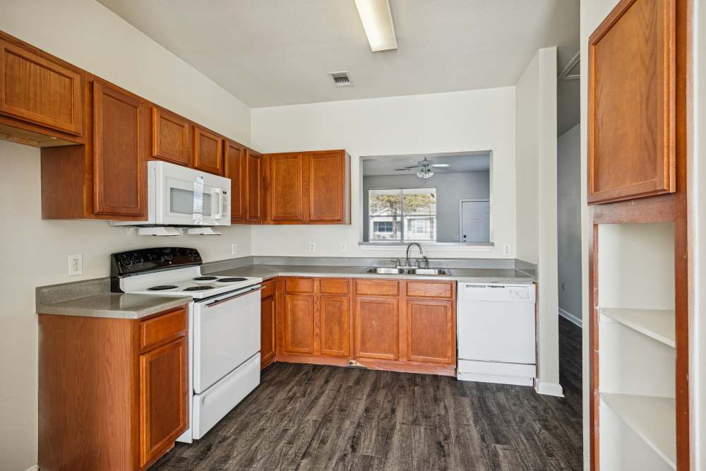 Spacious kitchen with wood-style flooring at Gibraltar Senior in Clute, Texas
