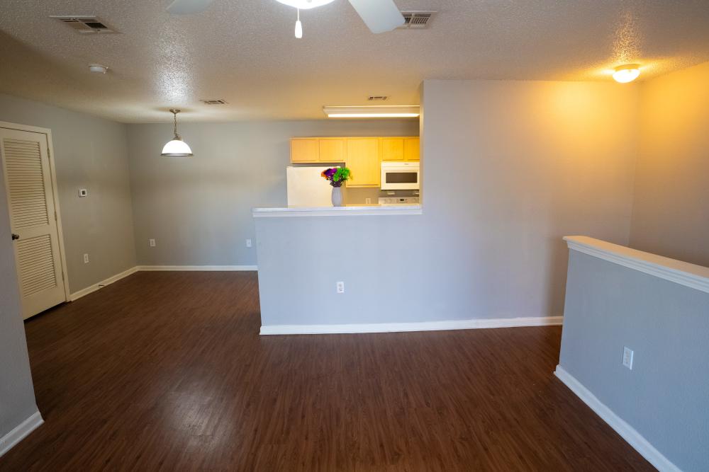 Combined view of the kitchen and the living room at Hampton Chase in Palestine, Texas