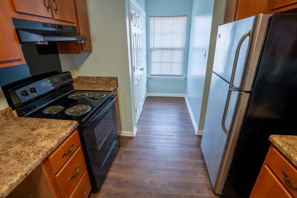 Kitchen with wooden cabinetry at Arrington Estates of West Memphis in West Memphis,Arkansas