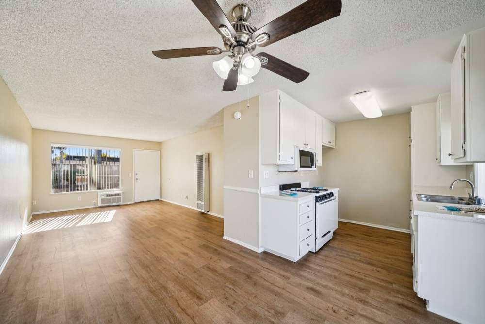 Apartment kitchen and living area at Casa Sierra in Riverside, California