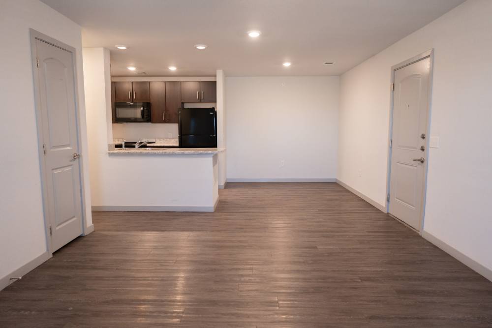 Unfurnished living room with view to kitchen at Estates At Rockwell in Oklahoma City, Oklahoma