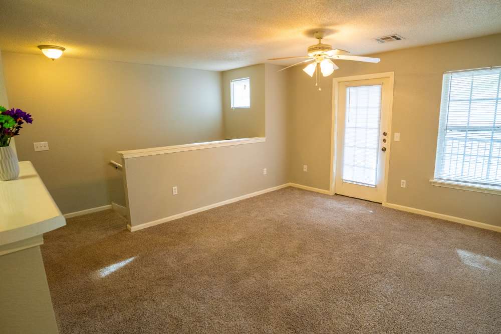Spacious living area with window at Hampton Village in Palestine, Texas