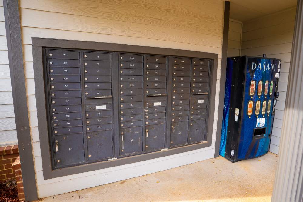 Mail boxes with cooldrink machine at Hampton Village in Palestine, Texas