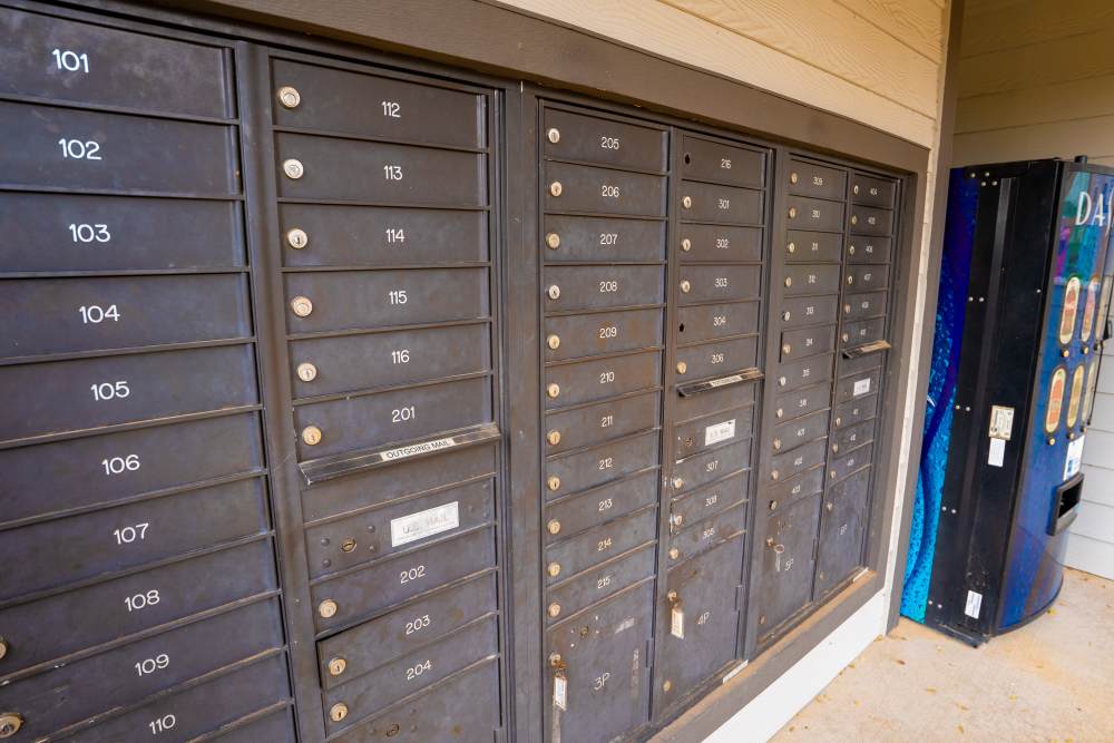 Mail boxes with cooldrink machine view at Hampton Village in Palestine, Texas