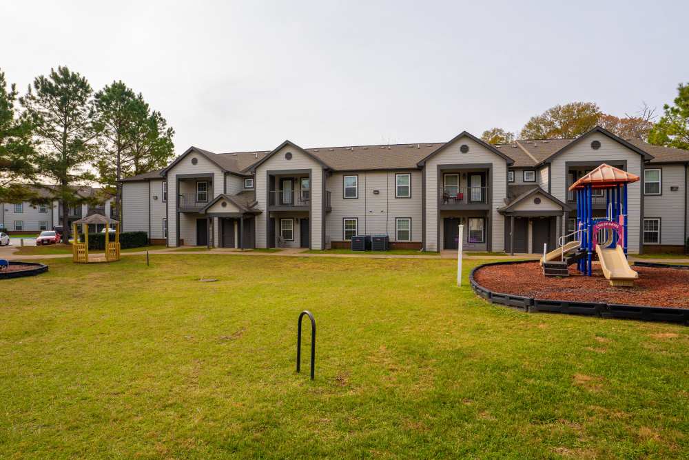Plaground and lawn view at Hampton Village in Palestine, Texas