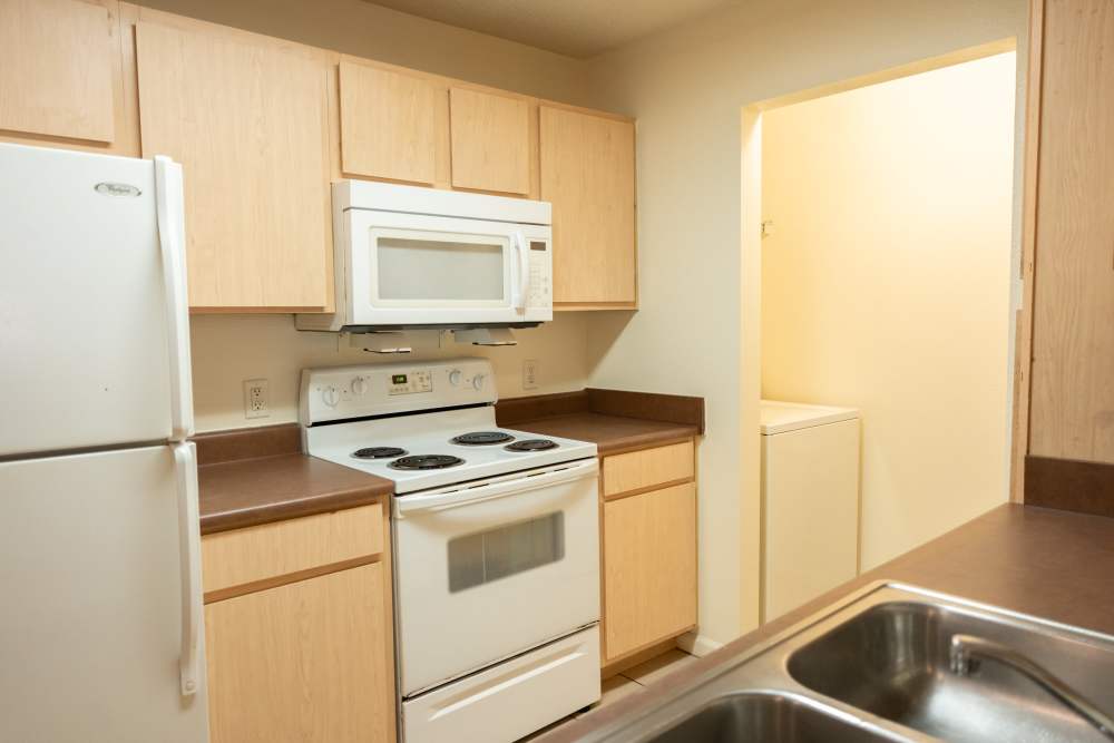 Bright kitchen with washer and dryer at Elizabeth Place in El Reno, Oklahoma