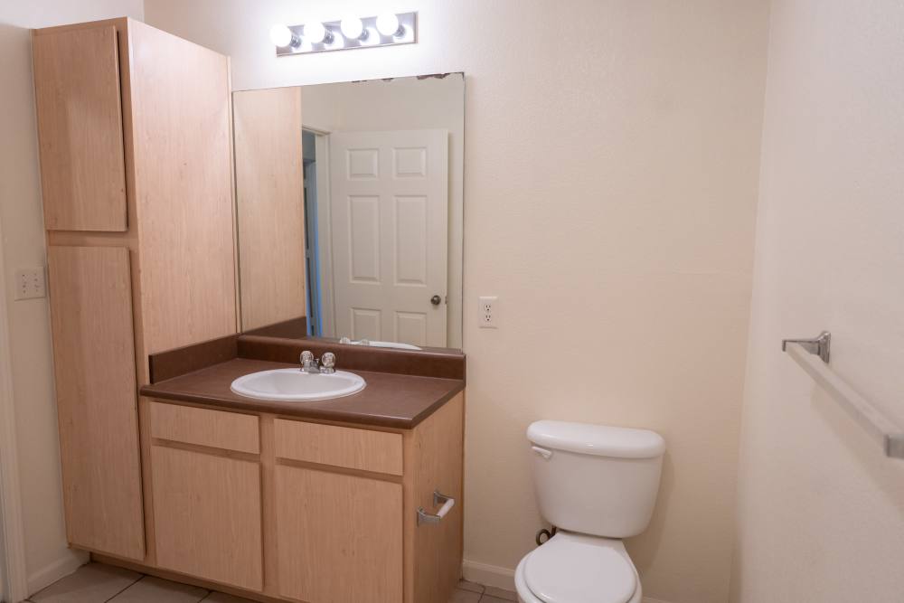 Bright bathroom with full height cabinet at Elizabeth Place in El Reno, Oklahoma
