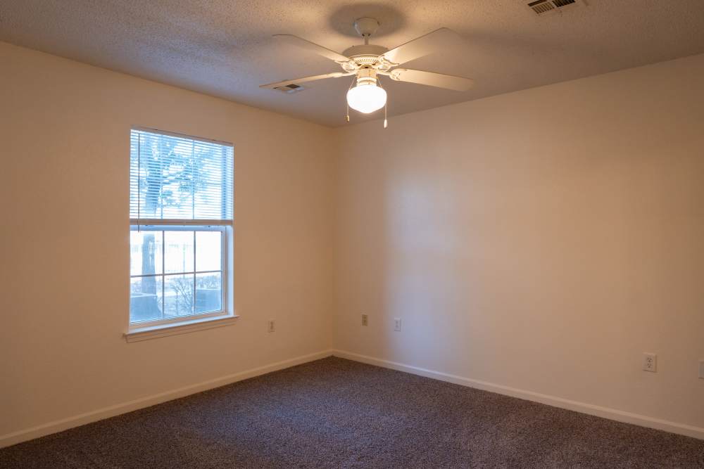 Bedroom with carpet flooring and window at Elizabeth Place in El Reno, Oklahoma