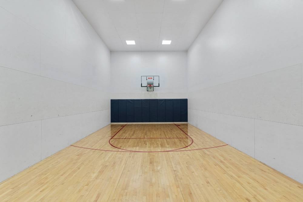 Indoor basketball court with hoop at Fairways on Green Valley in Henderson, Nevada