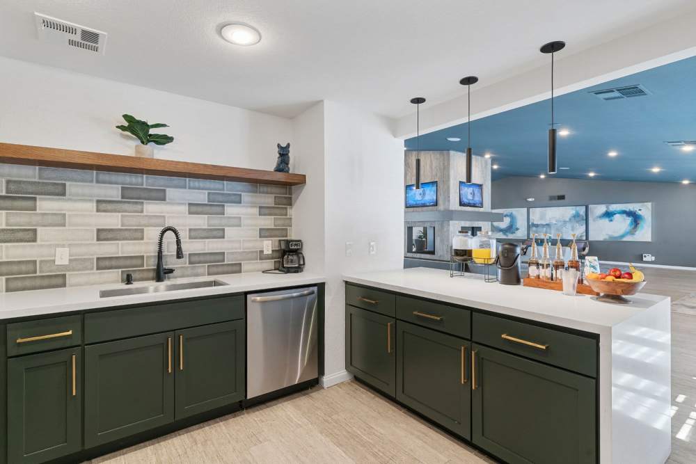 Modern kitchen with tiled backsplash at Fairways on Green Valley in Henderson, Nevada