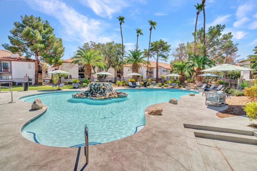 Resort‑style pool with lounge chairs at Fairways on Green Valley in Henderson, Nevada