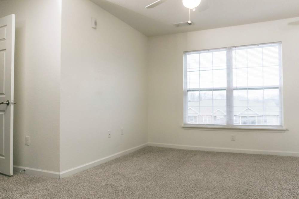 Bedroom with large windows at Hardin Terrace in Jefferson, Georgia