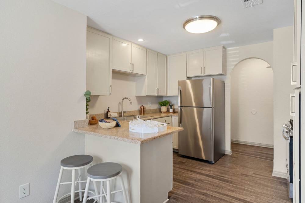 Kitchen with stainless steel appliances at Fairways on Green Valley in Henderson, Nevada