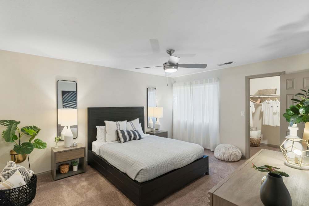 Bedroom with modern décor accents at Fairways on Green Valley in Henderson, Nevada