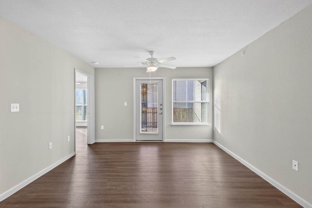 Living area with patio door at Juniper Pointe in Kaufman, Texas