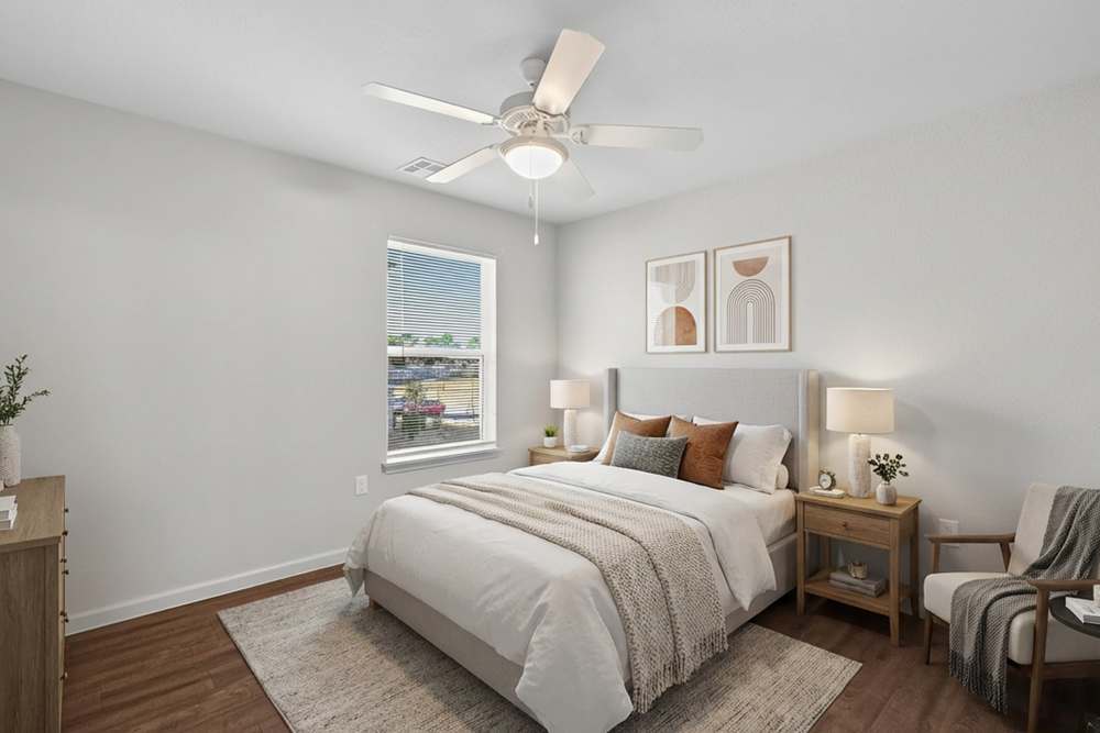 Modern bedroom with window at Juniper Pointe in Kaufman, Texas