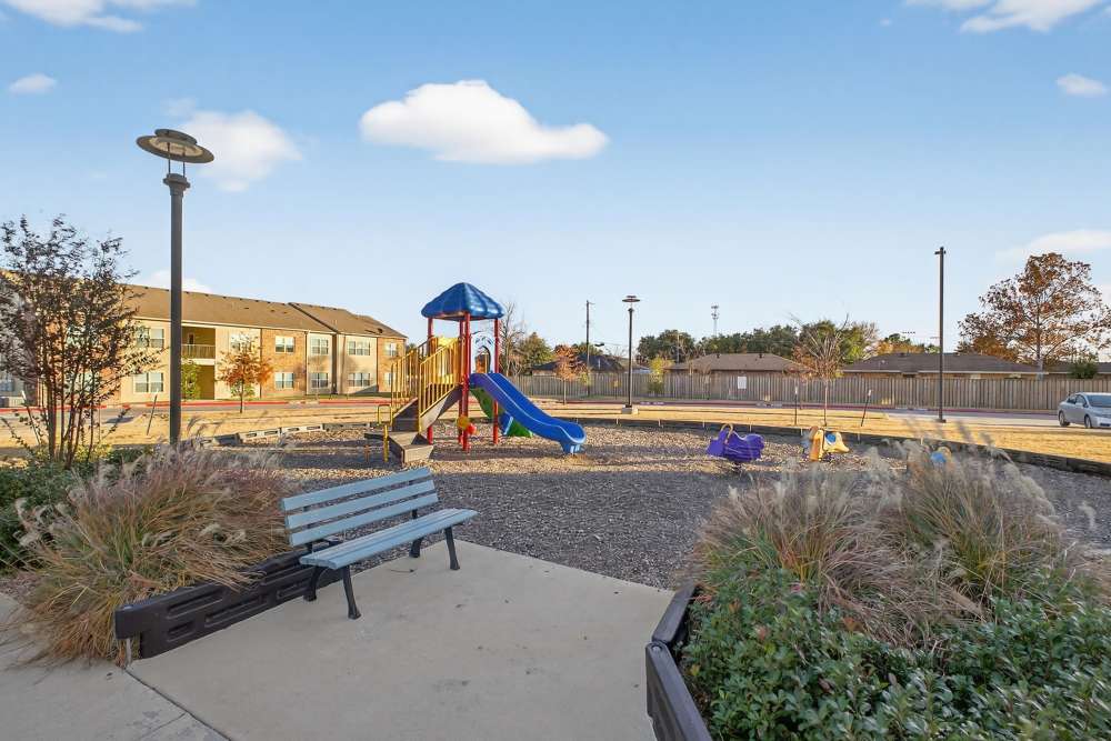 Seating near play area at Juniper Pointe in Kaufman, Texas