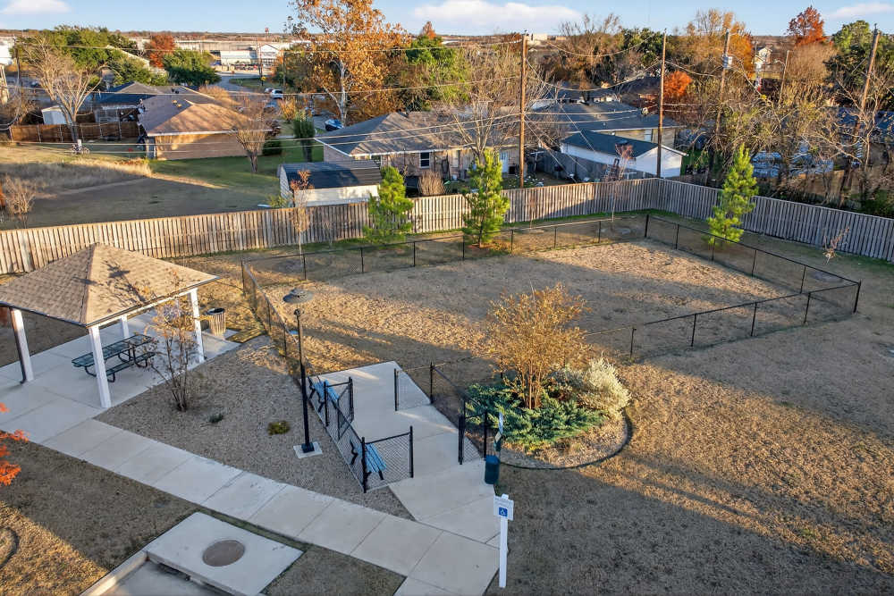 Play area with fence at Juniper Pointe in Kaufman, Texas
