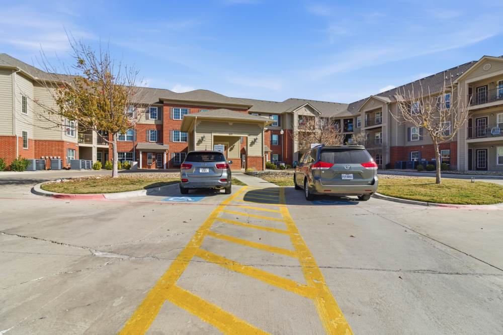 Vehicles parked infront of the apartment at Kirby Park in San Angelo, Texas