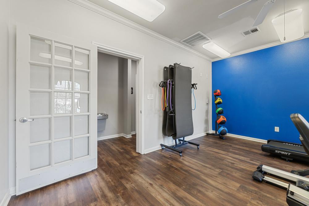 Fitness center with weights at Knightsbridge in Humble, Texas