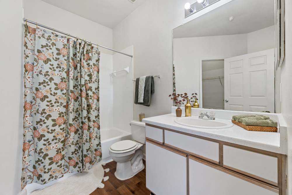 Bathroom with large mirror at Knightsbridge in Humble, Texas