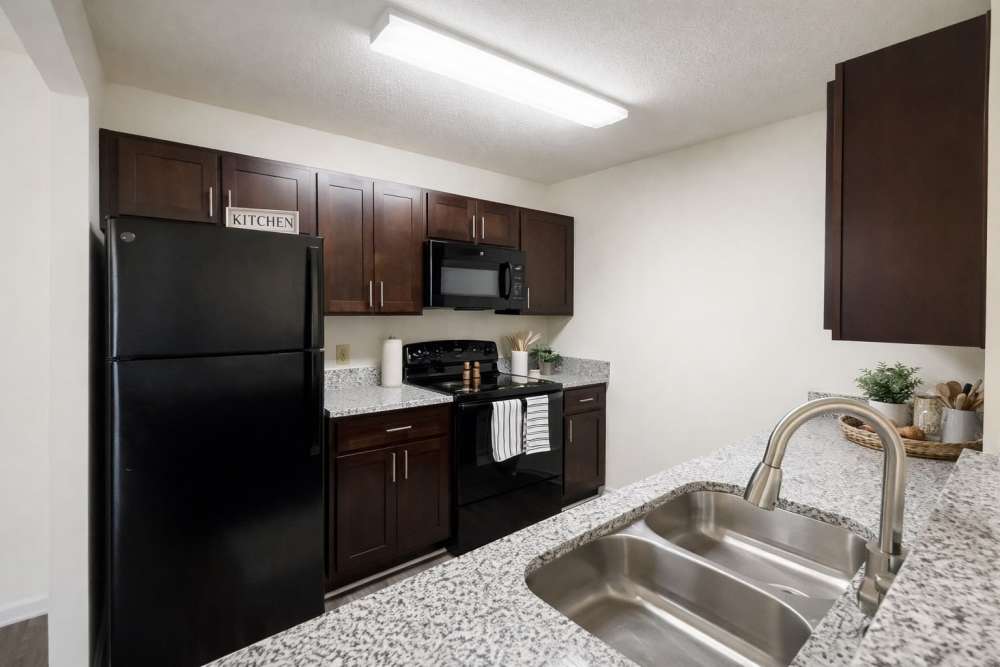 Apartment kitchen with modern appliances and ample cabinet space at Brittany Place of Rock Hill in Rock Hill, South Carolina