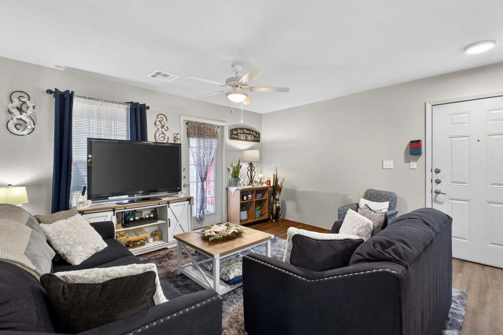 Charming living room with cozy seating and warm lighting at Lakewood Crossing in Granbury, Texas.