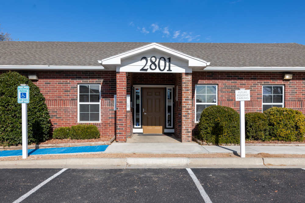 Building exterior with parking spaces at North Grand Villas in Amarillo,Texas