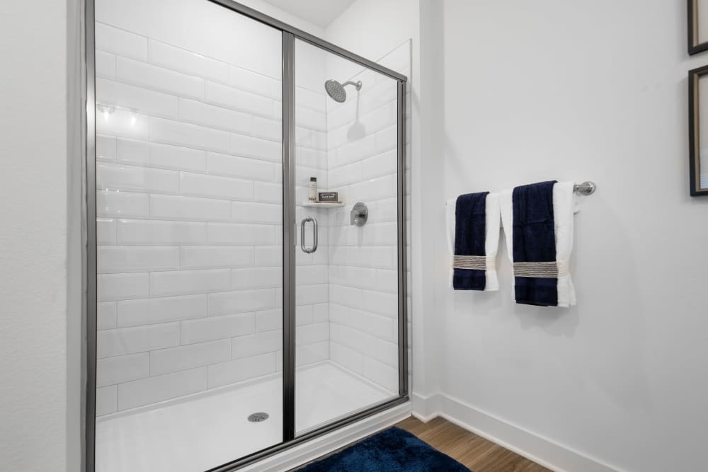bathroom with sliding glass door shower