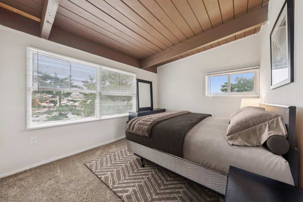 Bedroom with a large window at Belcrest Plaza in Hyattsville, Maryland