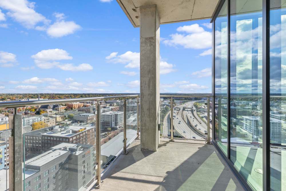 Balcony with glass railing overlooking city skyline and highway at Studio Park Tower & Lofts in Grand Rapids, Michigan