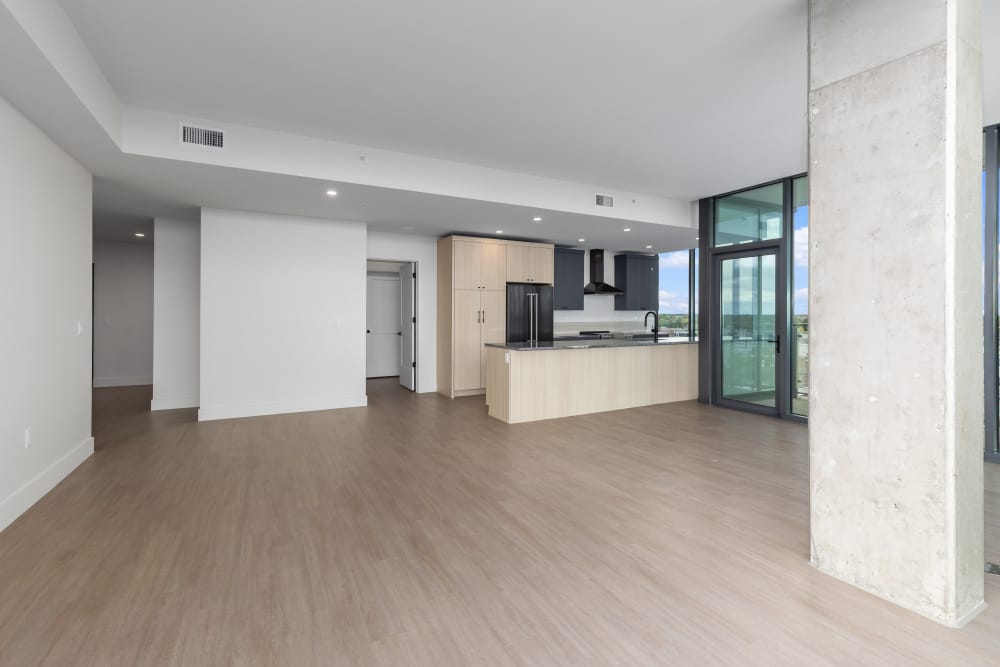 Modern open floor plan with kitchen and wide living space at Studio Park Tower & Lofts in Grand Rapids, Michigan