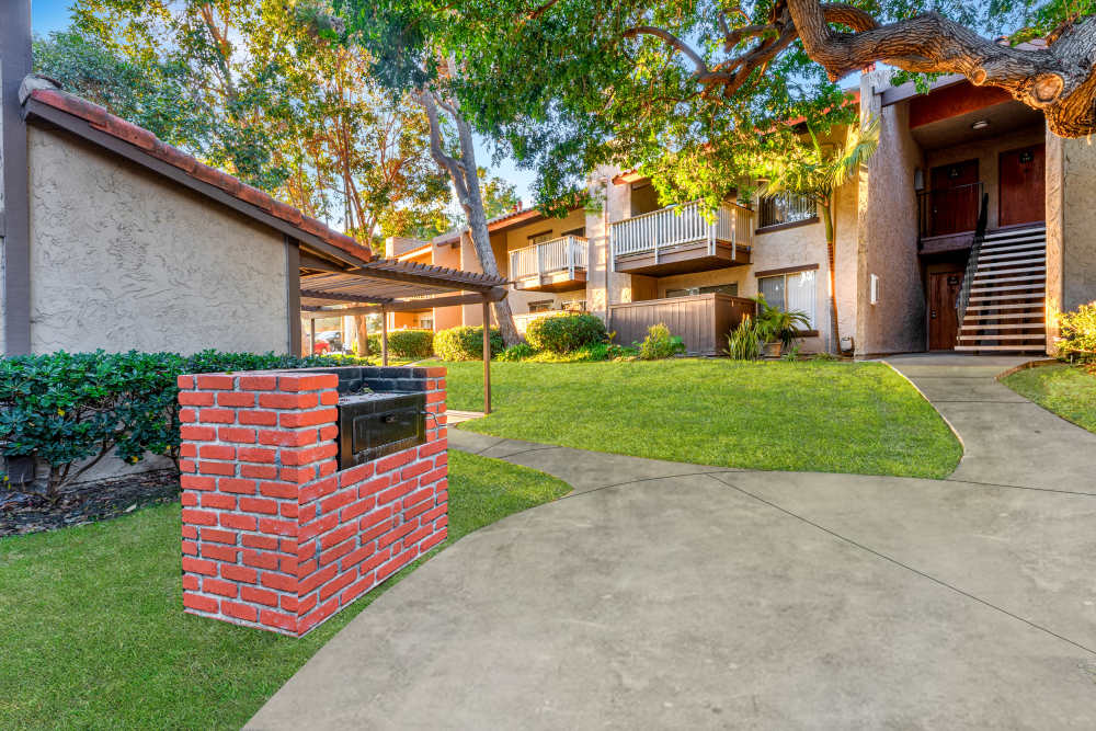 Community courtyard area with grill at Shadow Ridge Apartments in Oceanside, California