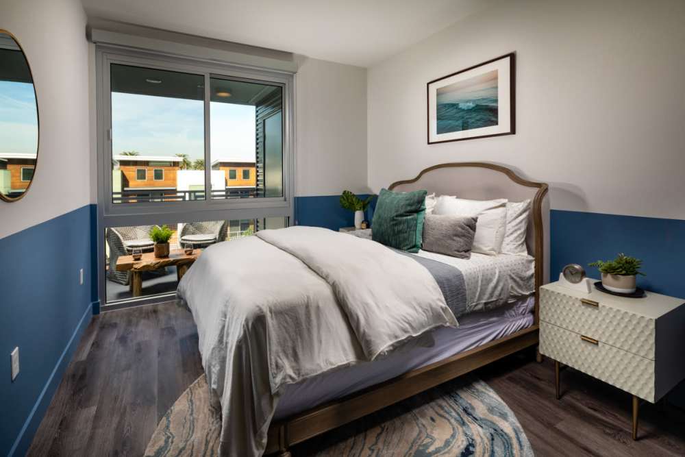 Bedroom with wooden flooring at Haven Apartments in Los Angeles, California
