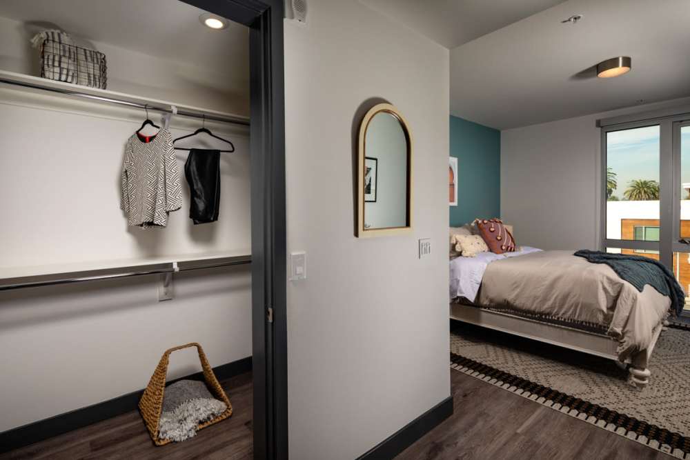 Bedroom with walk-in closet at Haven Apartments in Los Angeles, California