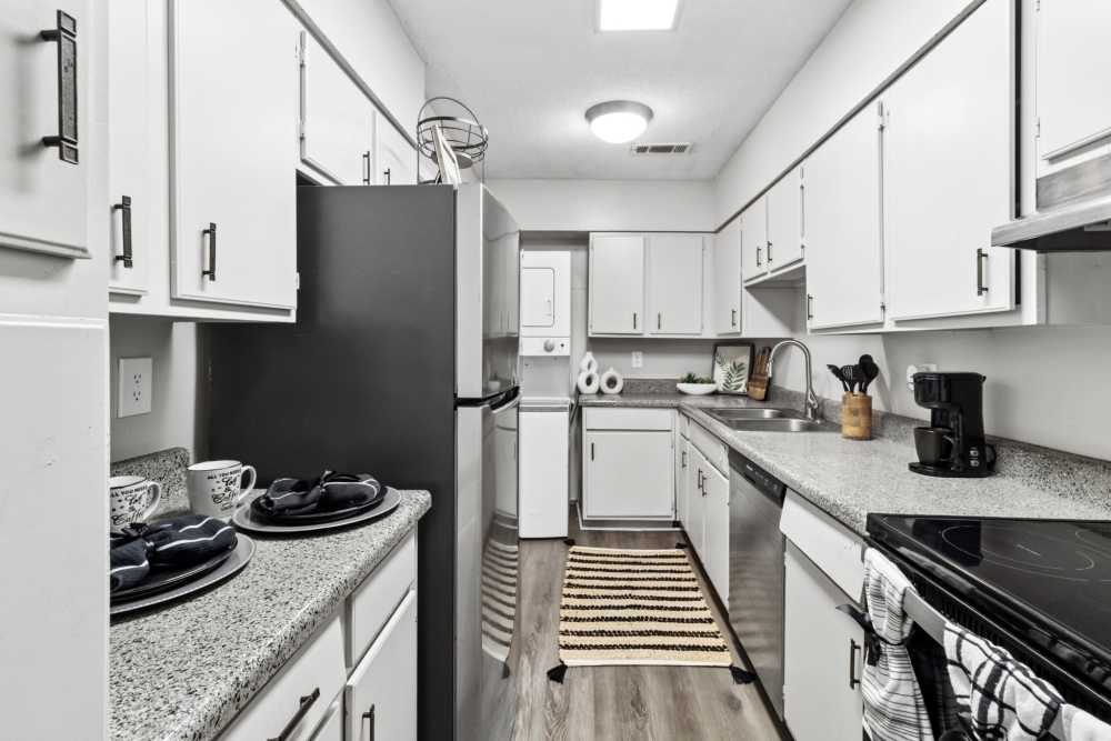Kitchen with wooden cabinets and stainless-steel appliances at River Oaks in Vicksburg, Mississippi