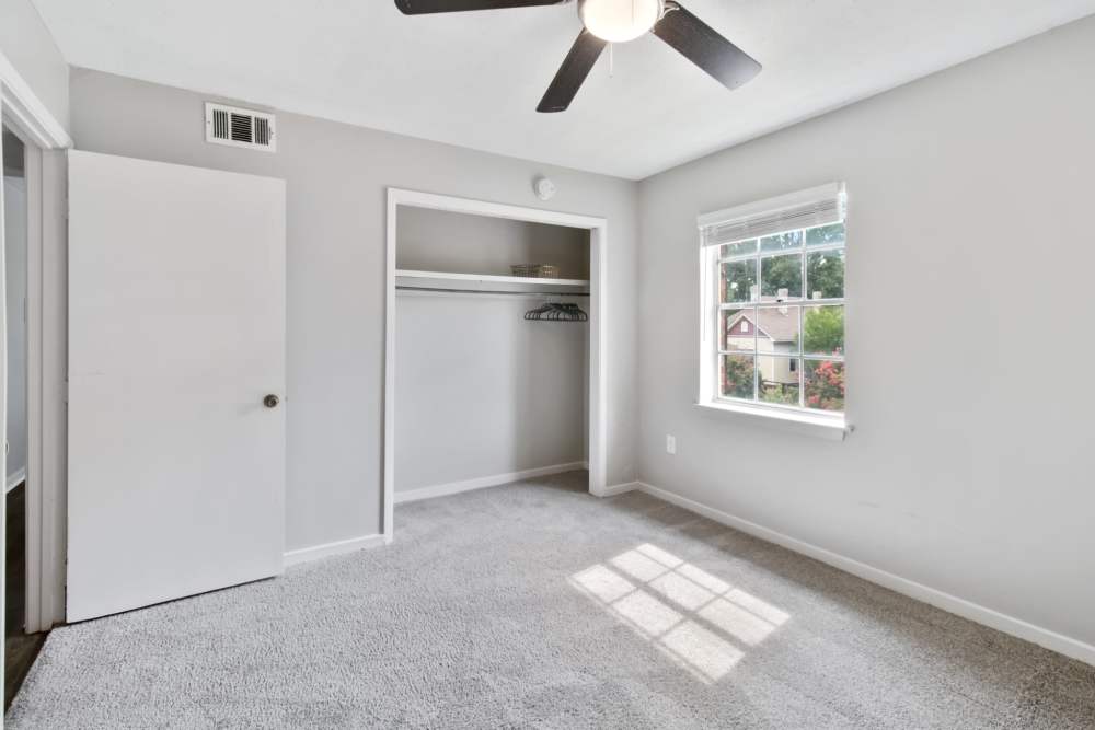 Bedroom with a walk-in closet at River Oaks in Vicksburg, Mississippi