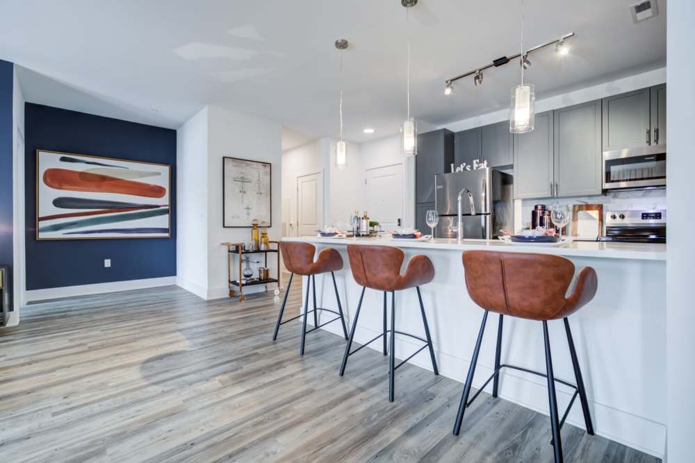 Stainless-steel appliances and a kitchen with an island at J Creekside at Exton in Exton, Pennsylvania