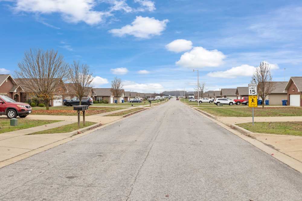 Community entry and parked vehicles at Oaklawn Estates in Rogersville, Missouri