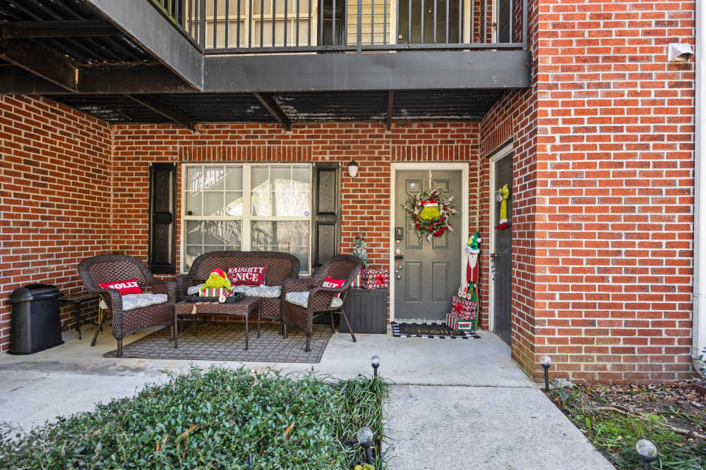 Apartment porch decorated with chairs at Livingston Oaks in Birmingham, Alabama 