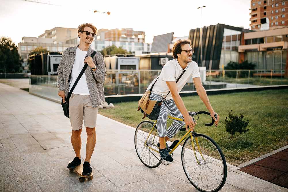 Residents skateboarding and biking to work near Highland Manor Apartments in Rochester, New York