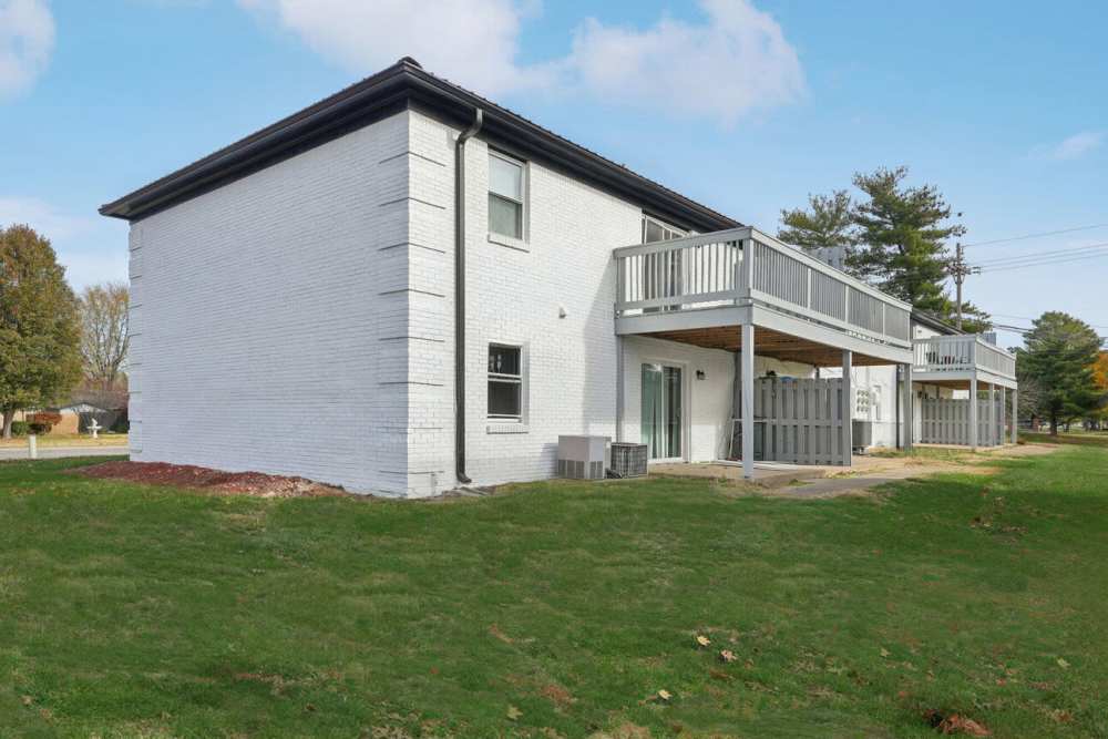 Side view apartment with with balconies, lawn at Charleston Square Apartments in Columbus, Indiana