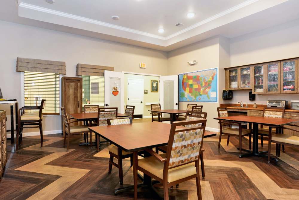 Cozy bedroom with a neatly made bed, dresser, and warm lighting, at Sky Vista in Mesa, Arizona