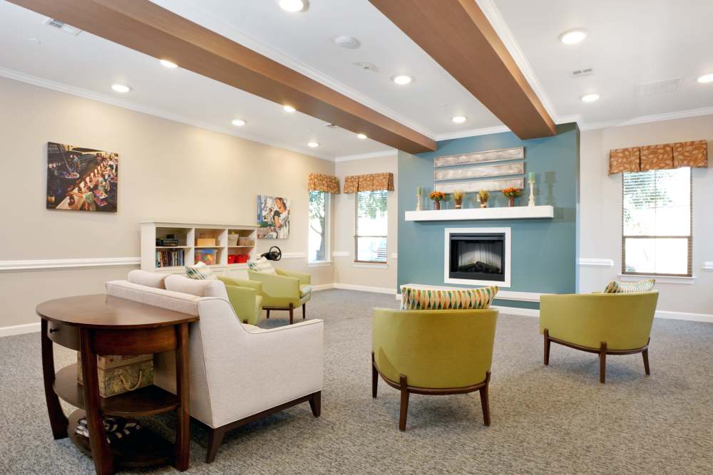 Large lounge with sofas, armchairs, and ceiling beams, at Sky Vista in Mesa, Arizona