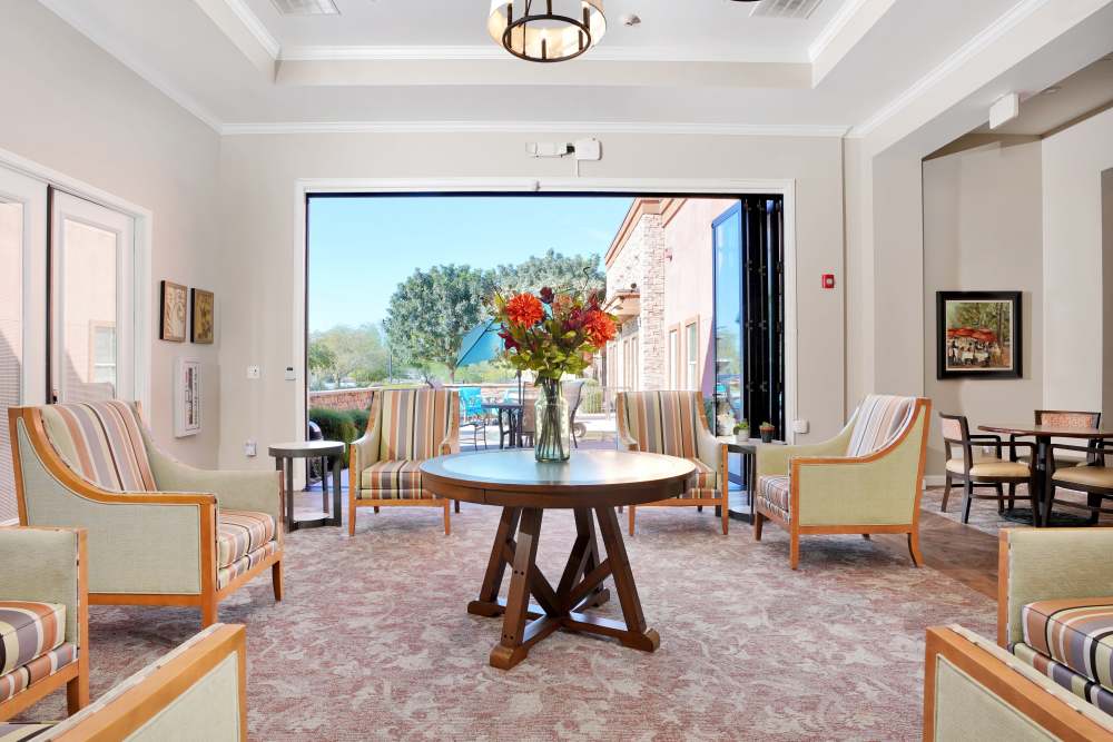 Elegant private dining room with a long table and framed artwork, at Sky Vista in Mesa, Arizona