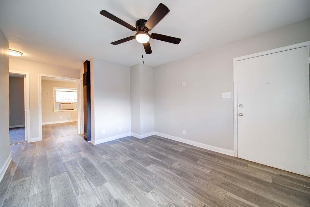 Unfurnished living room with a ceiling fan at Pine Ridge at Reynolda in Winston-Salem, North Carolina