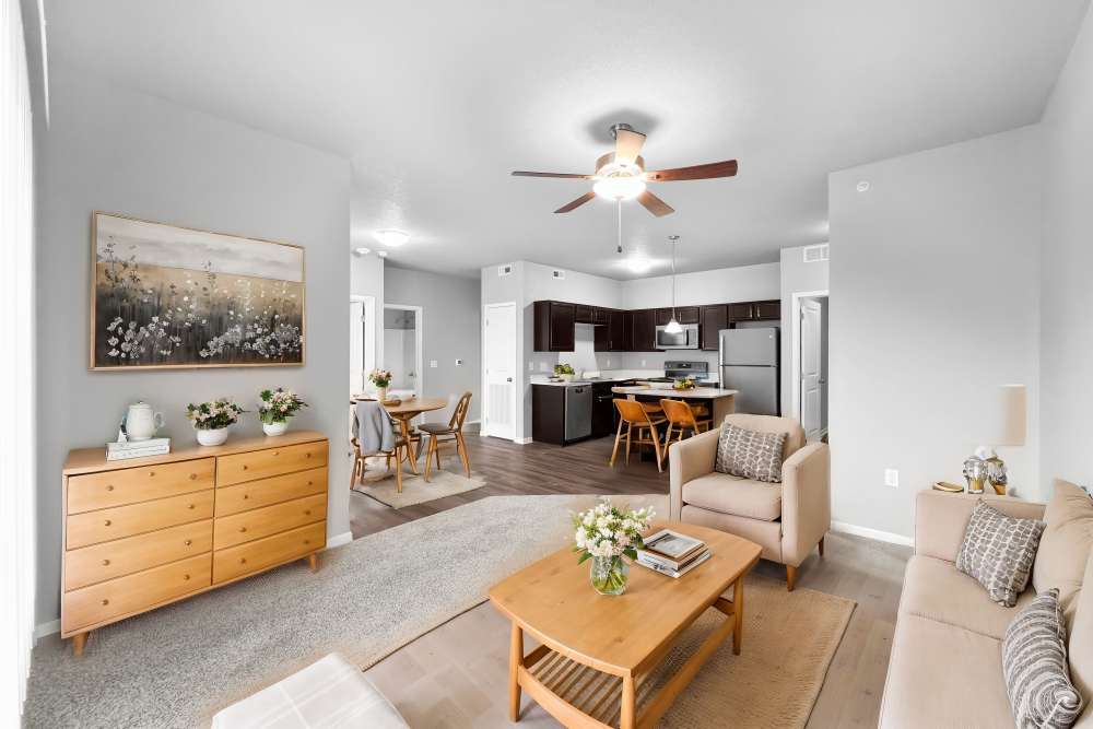 Spacious living room with modern kitchen and stylish decor at Alice Patricia Apartments in Waukee, Iowa