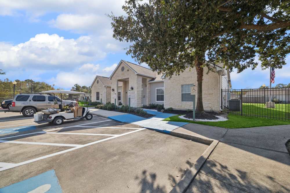 Exterior view of the community center with parking facility at Palm Garden in Orange, Texas