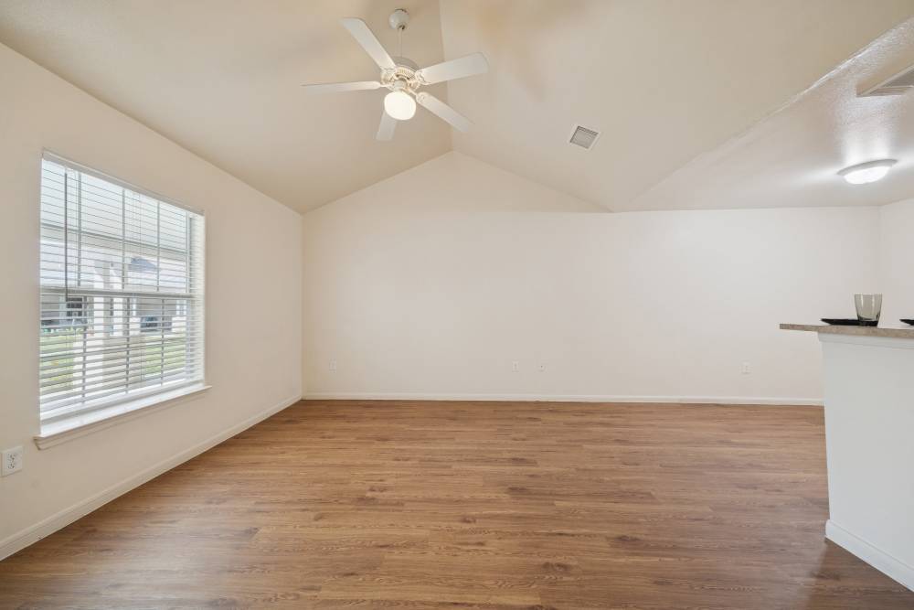 Unfurnished living room with access to kitchen at Palm Garden in Orange, Texas