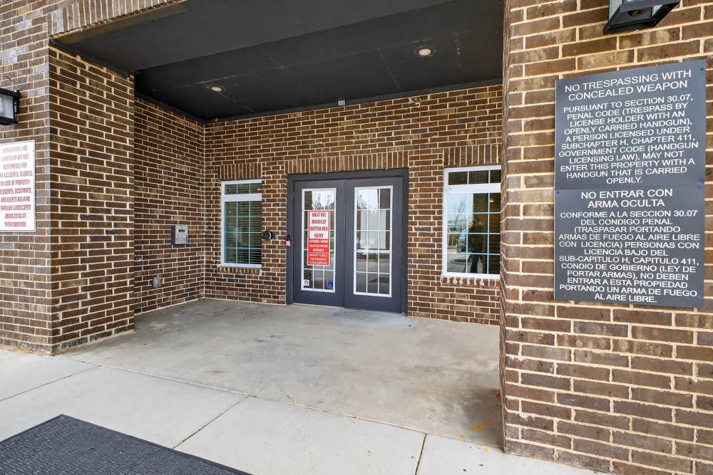 View of the property entrance at Hill Court Villas in Granbury,Texas